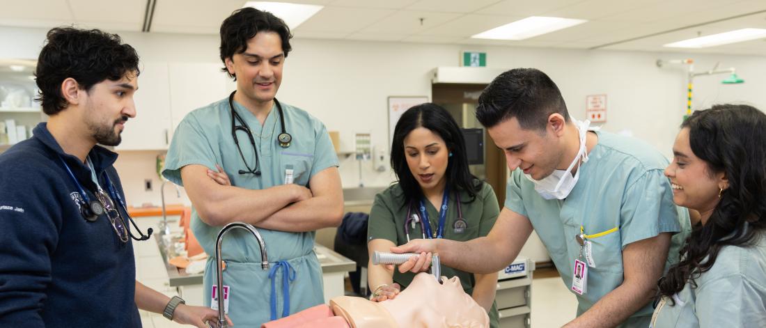 Students intubating a simulated patient.