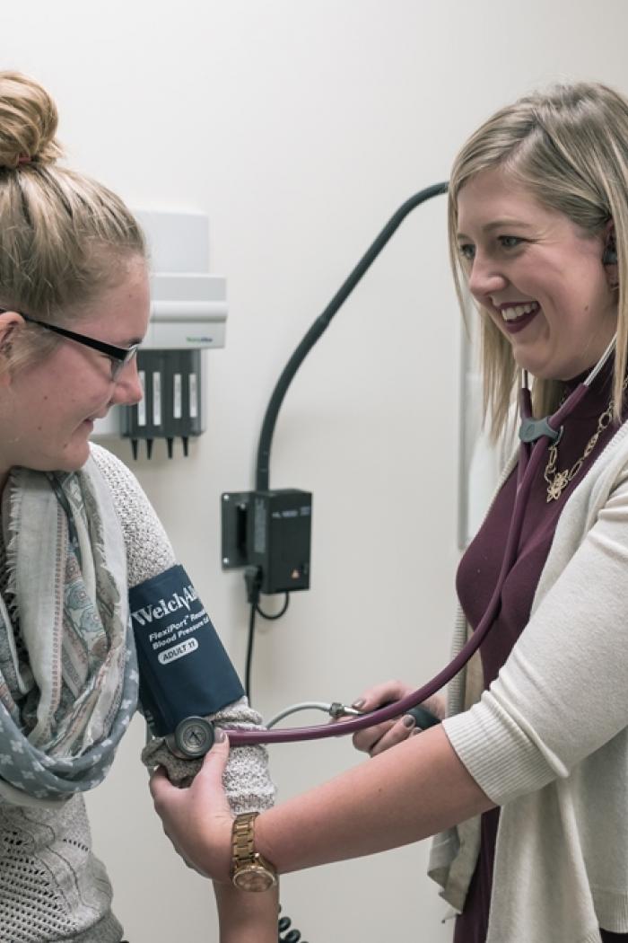 Patient has her blood pressure checked.