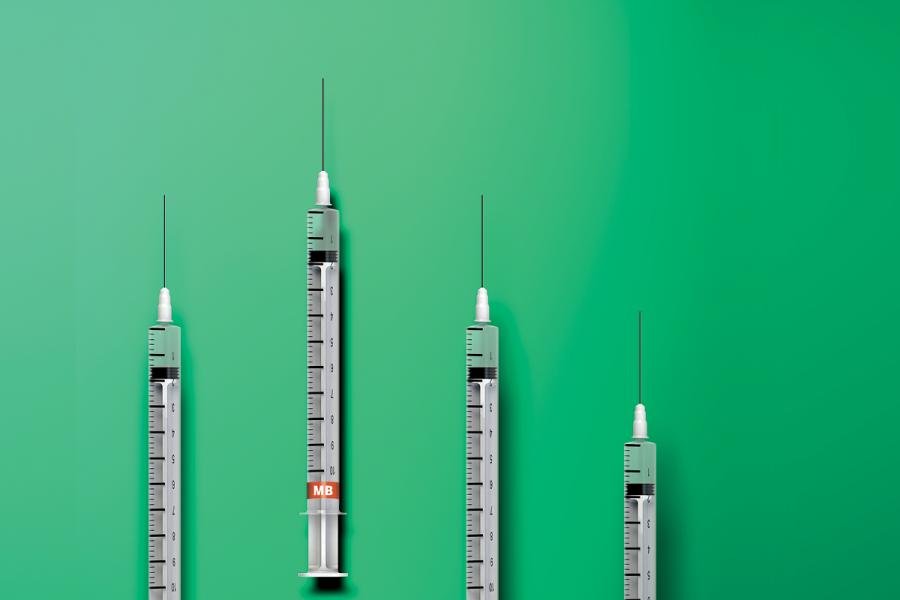 A series of needles on a green background.