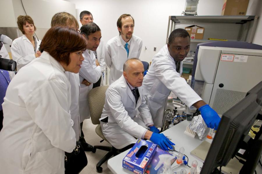 A group of people inside the immunology lab.
