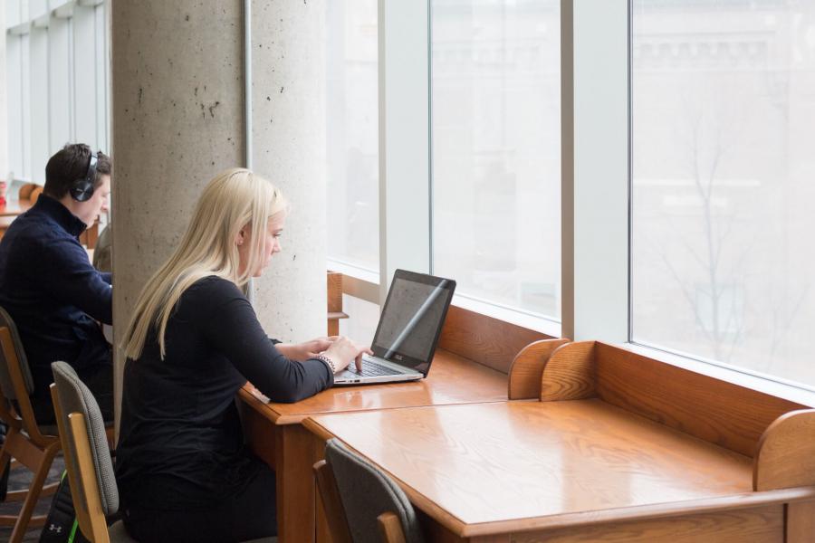 Students studying in a library.