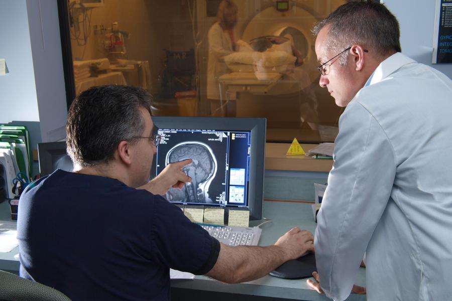 Researchers reviewing a brain scan.