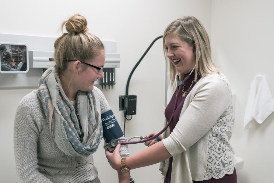 Patient has her blood pressure checked.