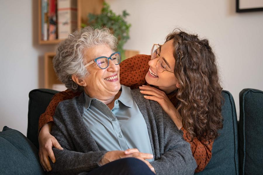 Smiling senior with younger woman.