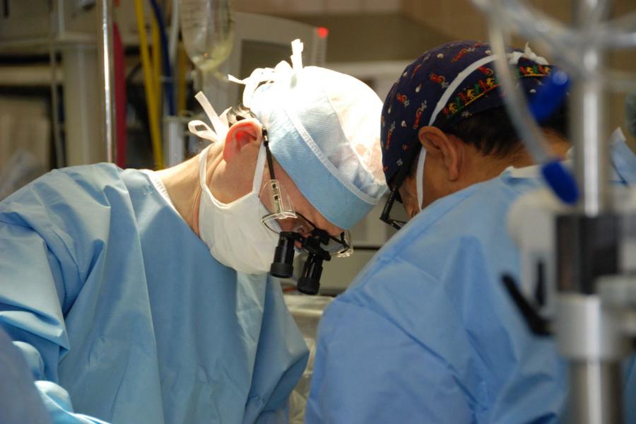 Surgeon working on a patient.