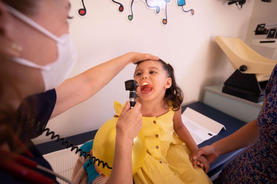 Physician examines a child.