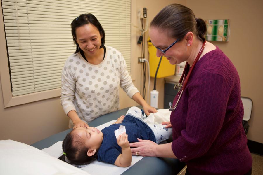 Physician examines a child.