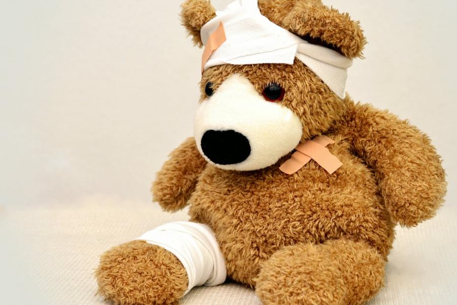 Image of a teddy bear with bandages.