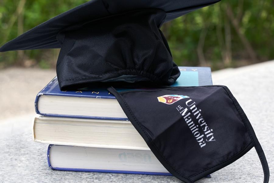 Convocation mortarboard and mask.