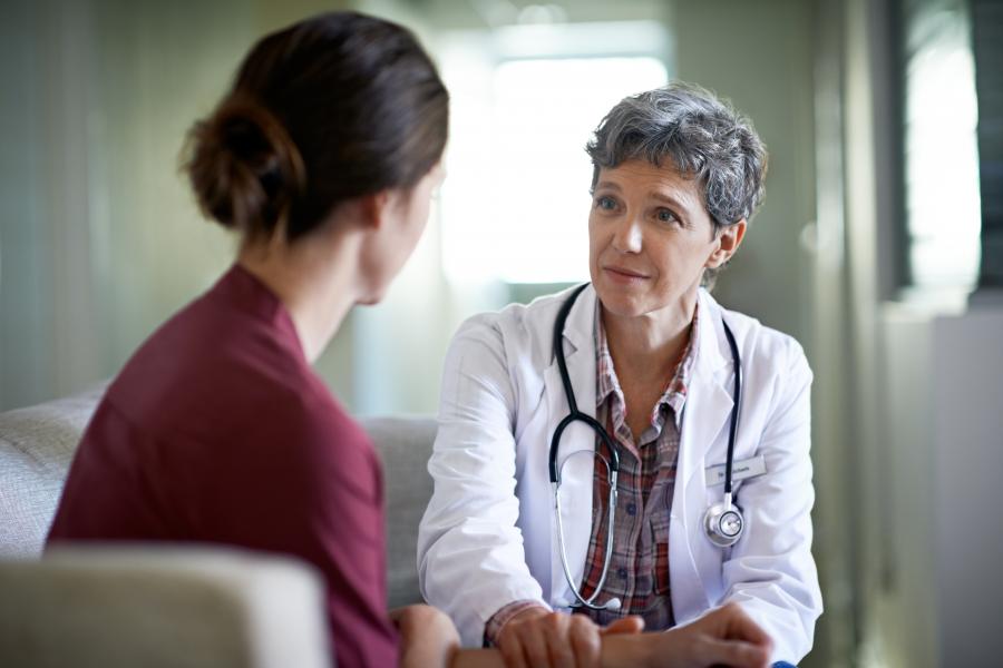 A doctor comforting a patient.