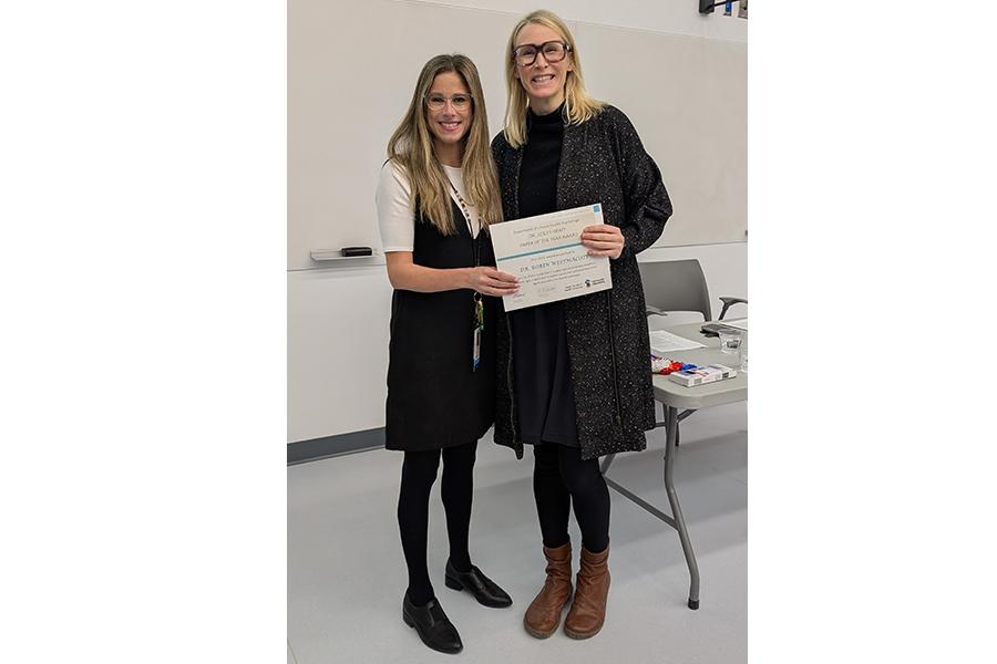 Left to right: Dr. Renee El-Gabalawy, Research Director, presenting and award to Dr. Robin Westmacott.