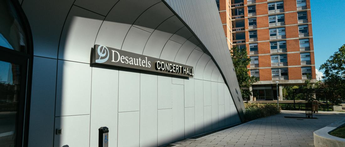 front of concert hall with sign