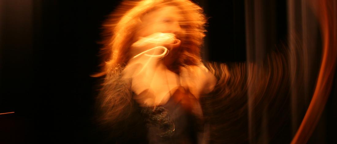 blurred image of a singer