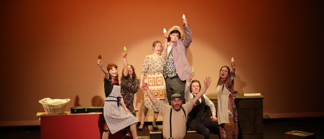 students onstage at a play
