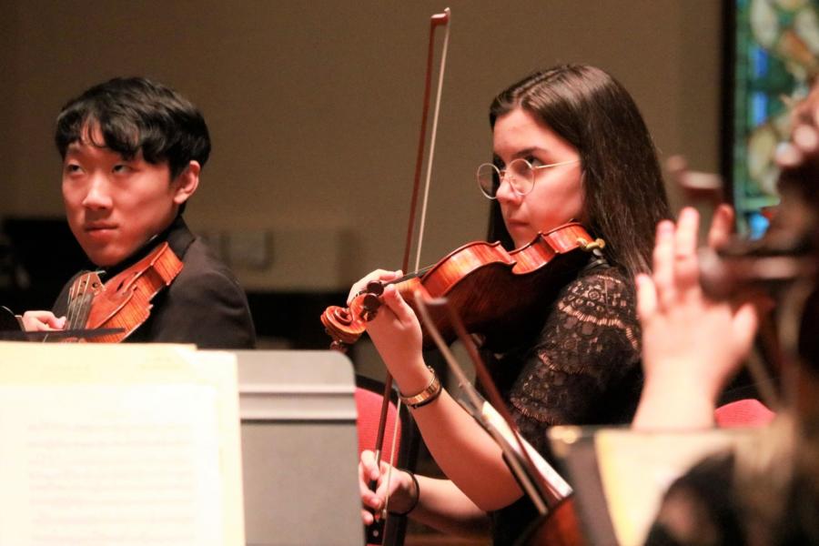 Violin students performing at a University of Manitoba Symphony Orchestra concert