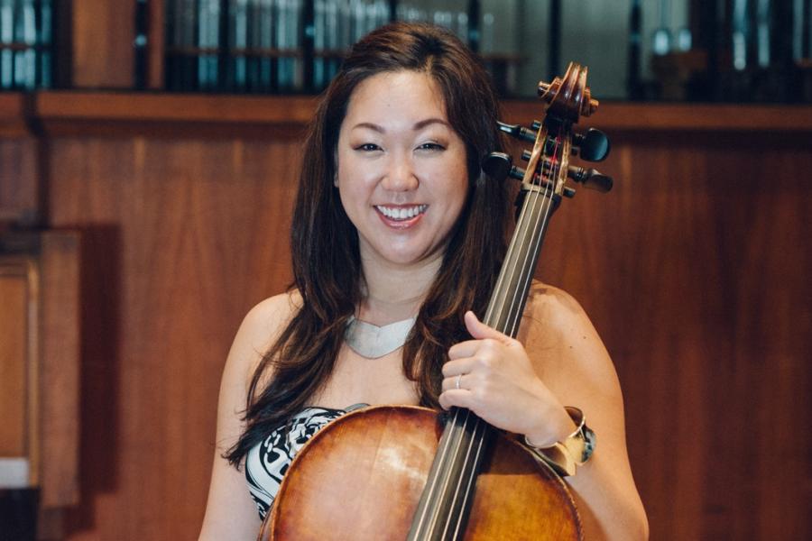 Associate professor Minna Chung sitting with cello