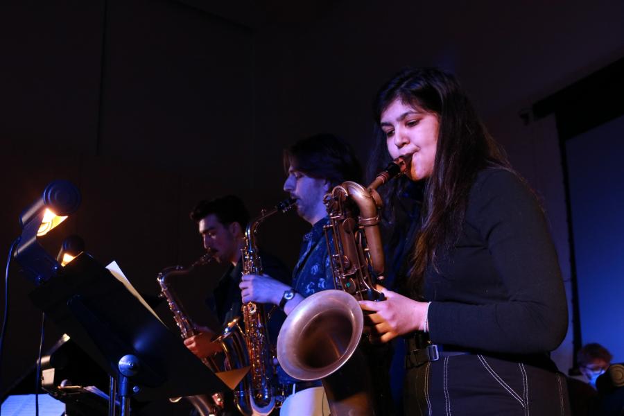 Three student jazz musicians perform in concert