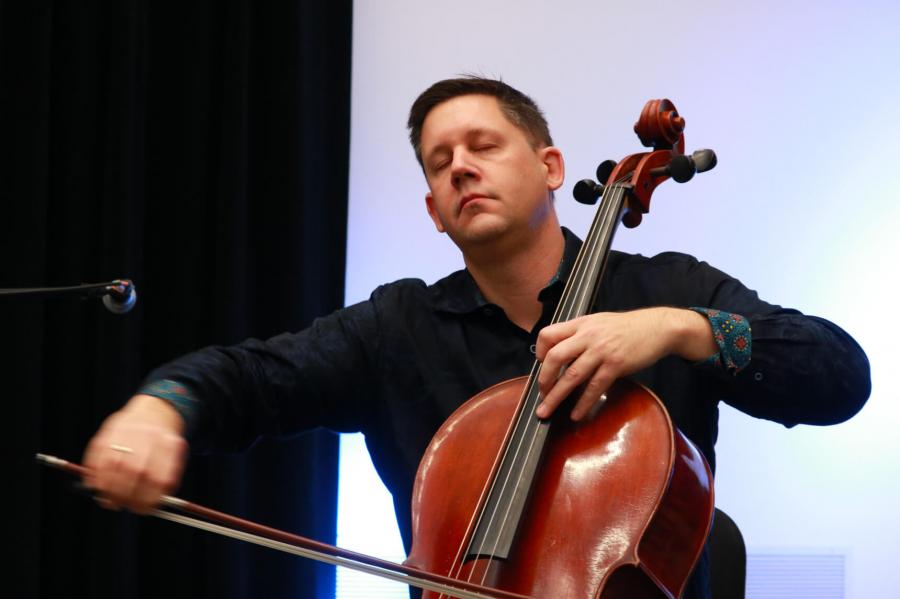 Guest performer Nick Photinos playing the cello. 