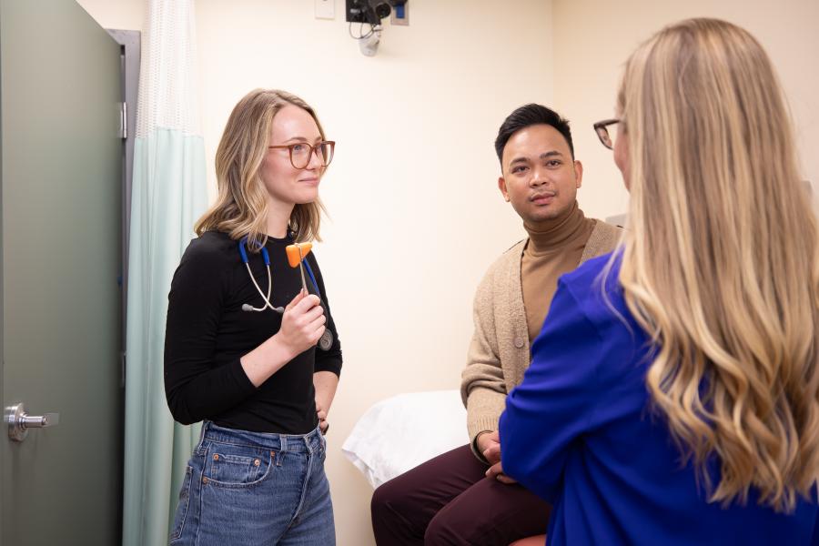 Nurse practitioner program students in an exam room