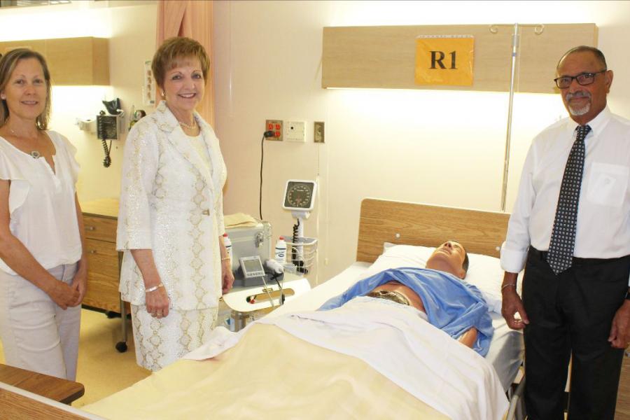 Dean of Nursing Netha Dyck poses with two donors.