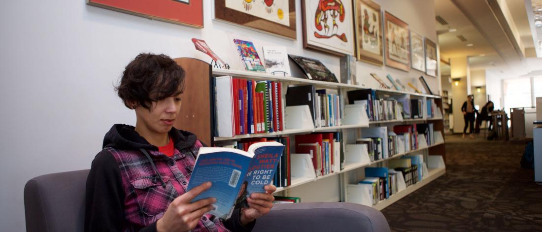 Student reading a textbook.