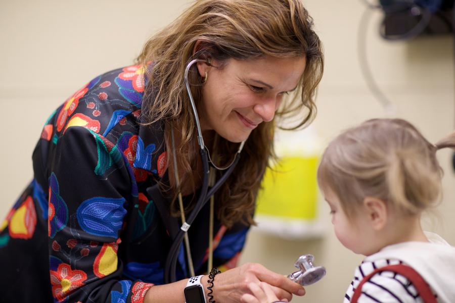 Physician examining a baby.
