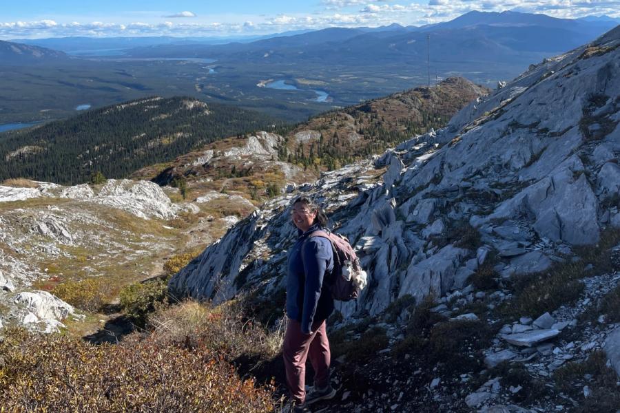 A learner poses on hillside in Whitehorse, Yukon.