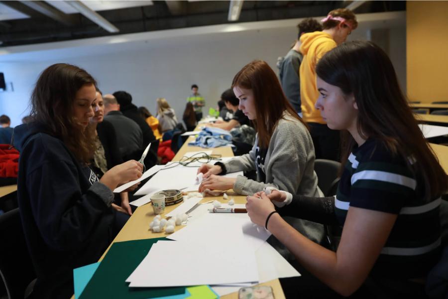 SET Day participants working together at tables.