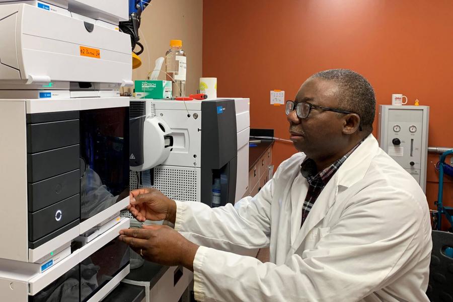 Dr. Rotimi Aluko conducts lab work