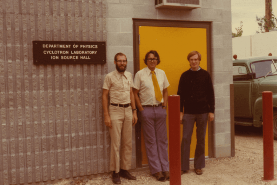 a photo of a group of people in front of the department of physics cyclotron entrance
