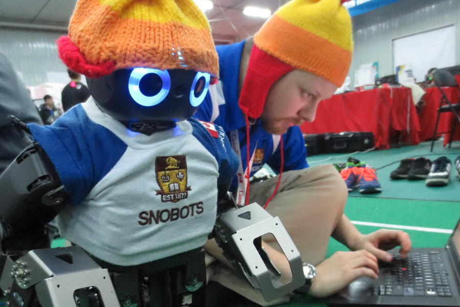 a student programming a robot