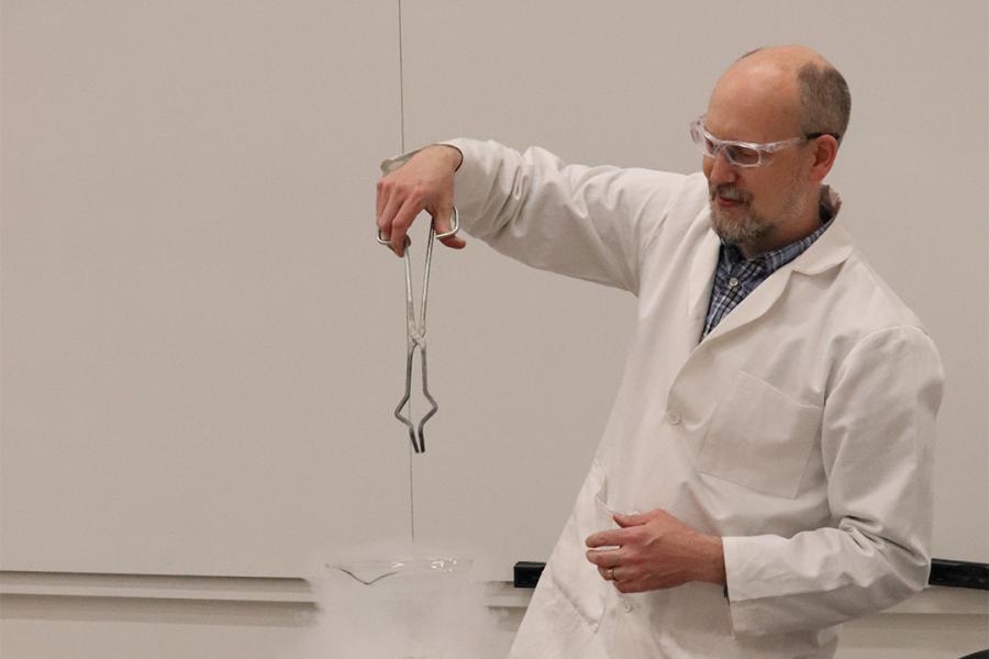 A chemist experimenting at Science Rendezvous.