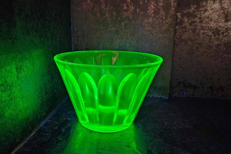 Uranium glass shining green.