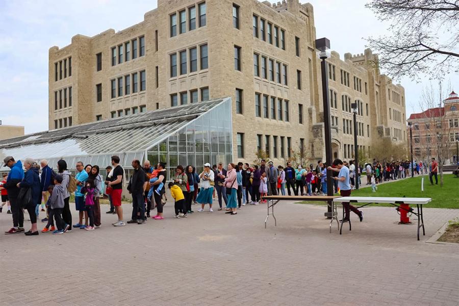 A line of people outside the science complex.