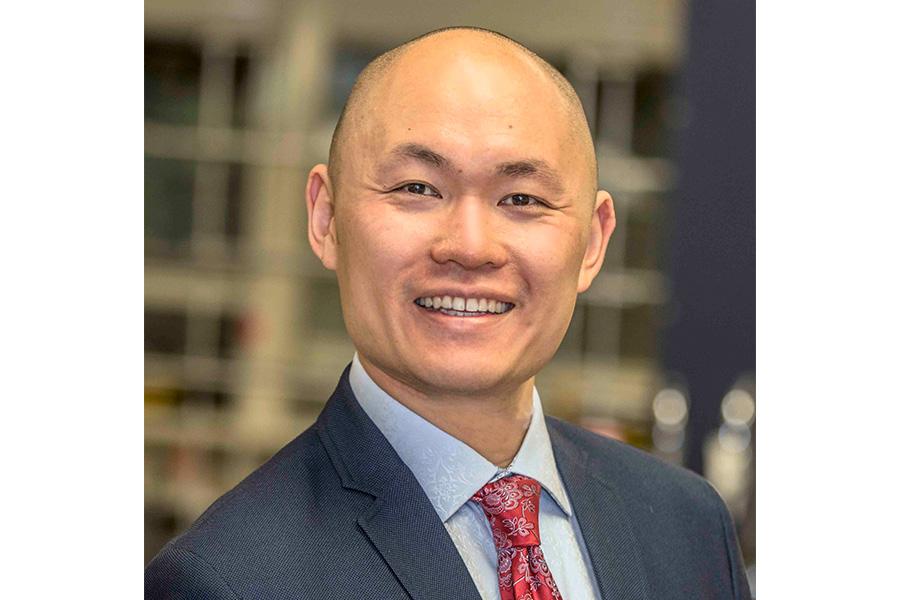 Horace Luong smiling at the camera.