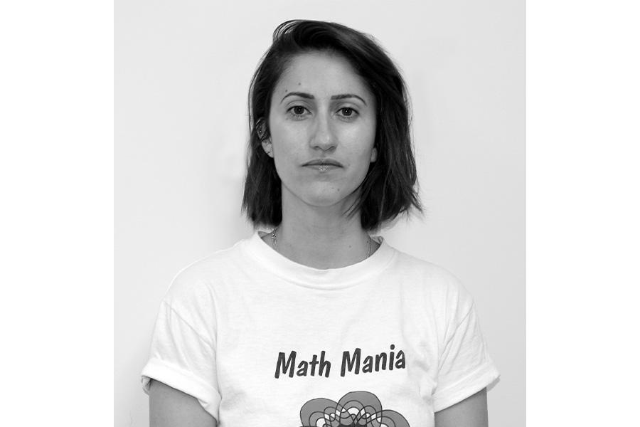 Darja Barr looking at the camera  with a Math Mania shirt.