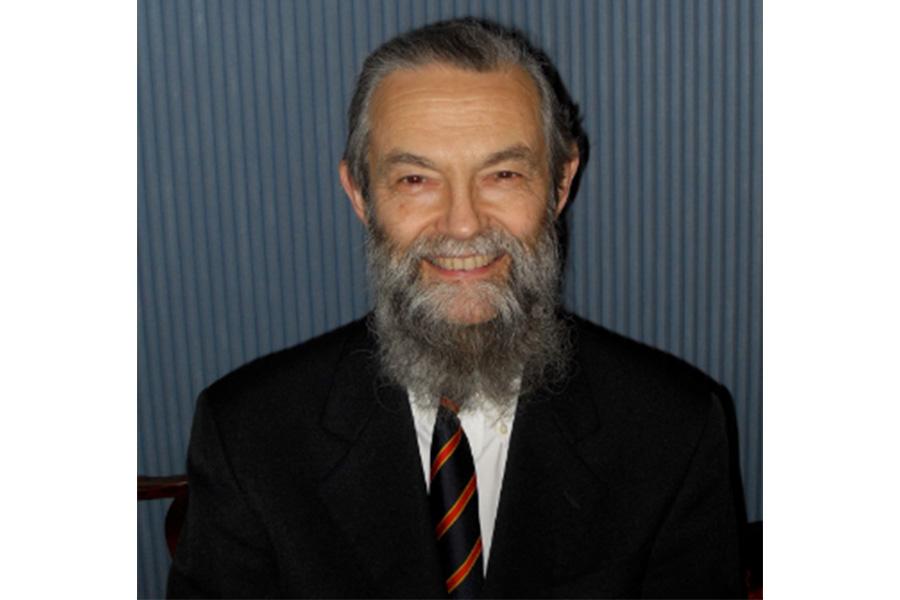 Robert Thomas smiling at the camera.