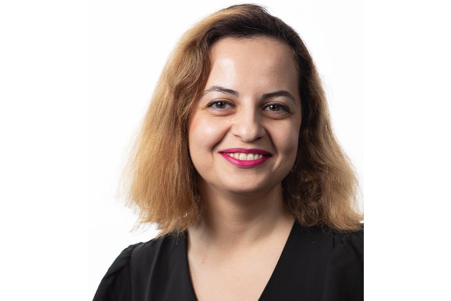 Sadaf Salehkalaibar smiling at the camera.