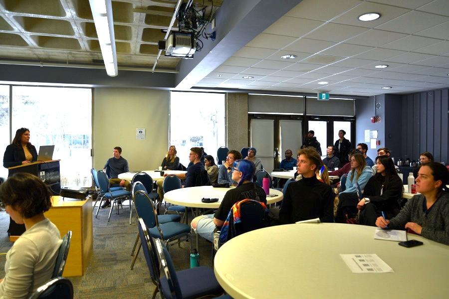 A wide shot of the now presenting science workshop.