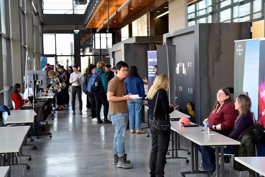 A group of people visiting the booths during the smartpark event.