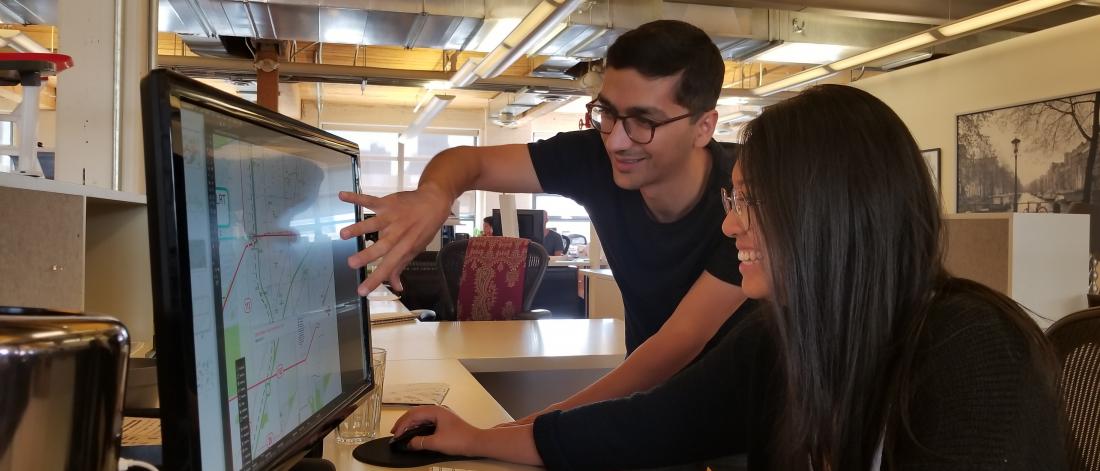 co-operative education students looking at computer