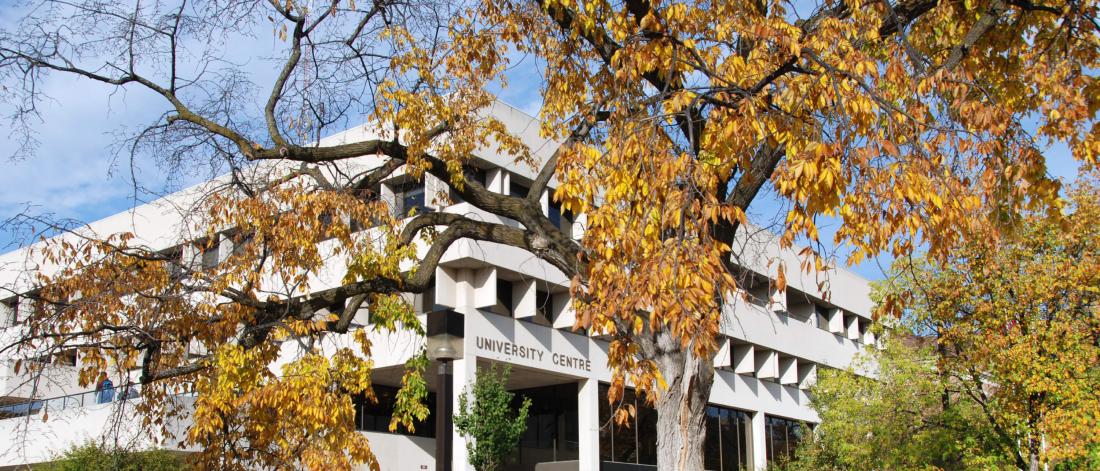 An exterior view of the University Centre building on an autumn day.