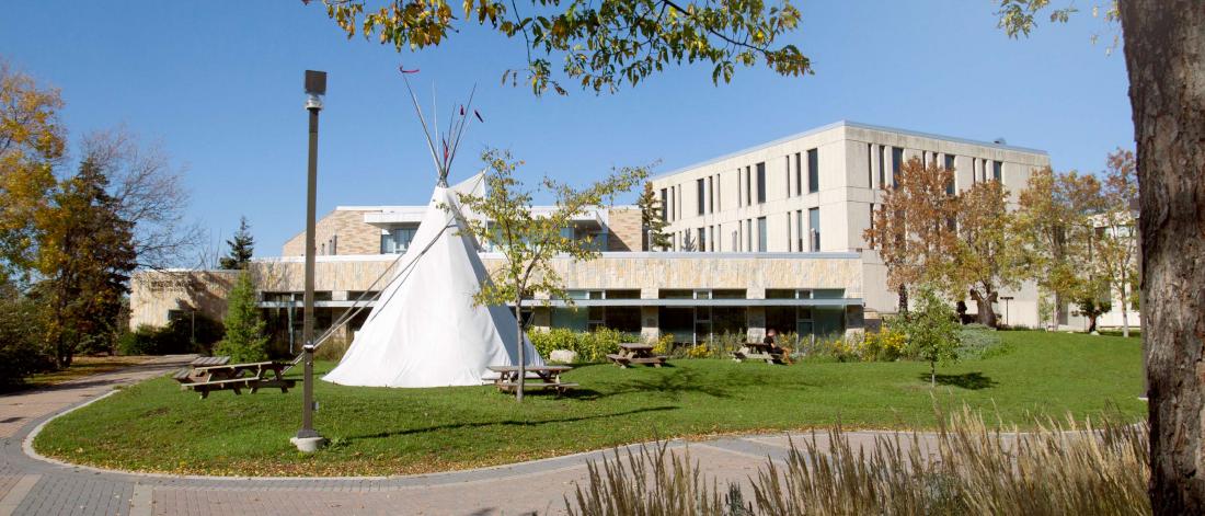 image of tipi in front of migizii agamik.