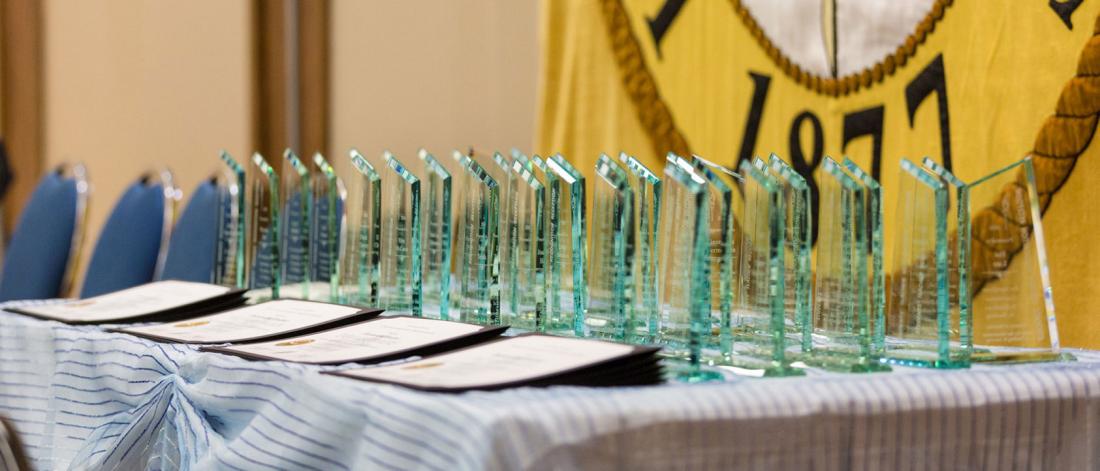 Engraved STRR awards lined up on a table