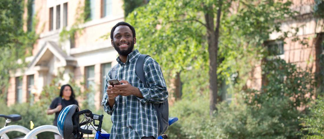 A black male student smiling.