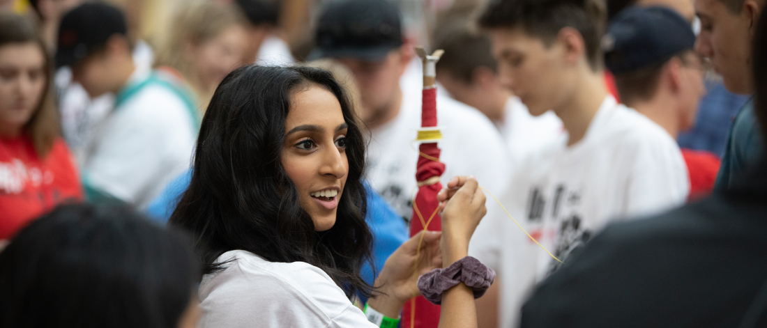 Student with flag at welcome day