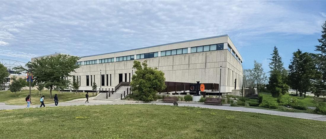 An exterior view of the Education Building on the Fort Garry campus in summer.