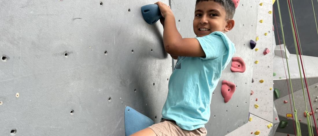 child climbing wall