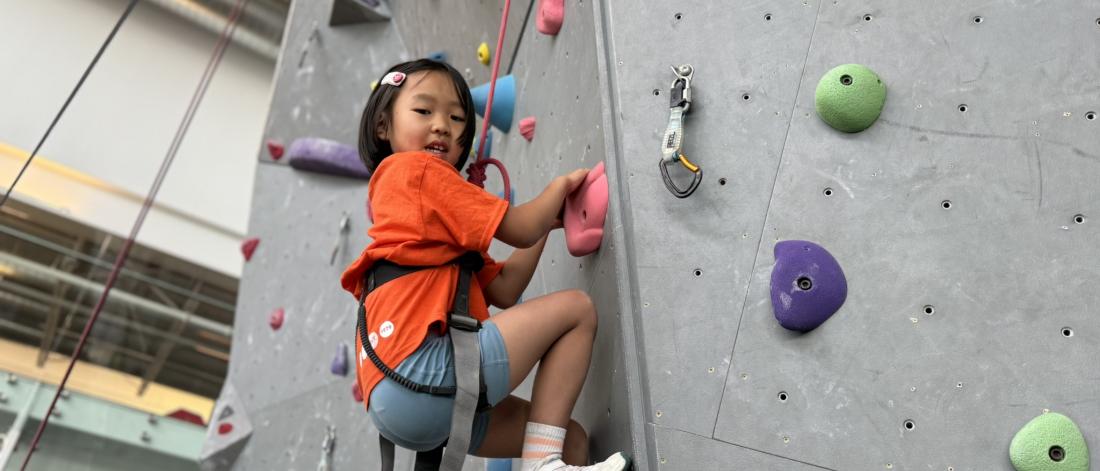 child climbing wall