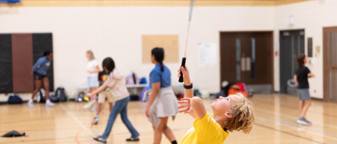 child playing badminton